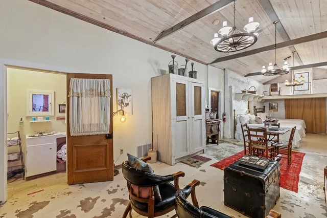 a view of a swimming pool with an outdoor space and seating area