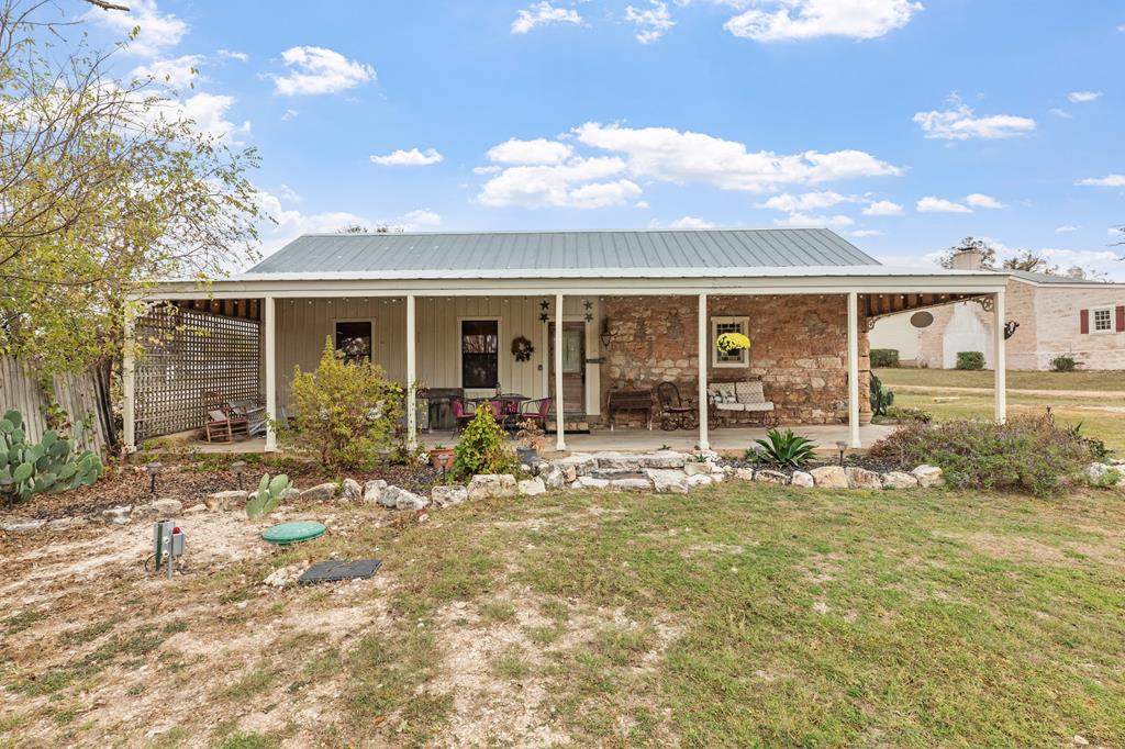 1447 Royal Oaks Loop Fredericksburg, TX 78624 - Photo 50 of 98 a view of a house with backyard