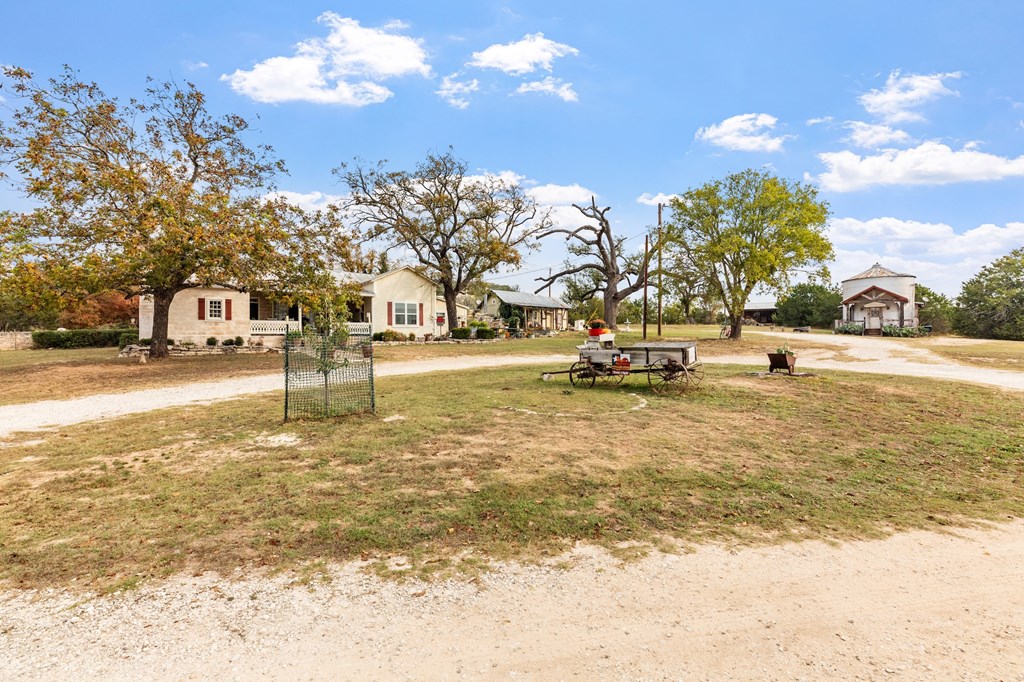 1447 Royal Oaks Loop Fredericksburg, TX 78624 - Photo 91 of 98 a view of a swimming pool with an outdoor space and seating area