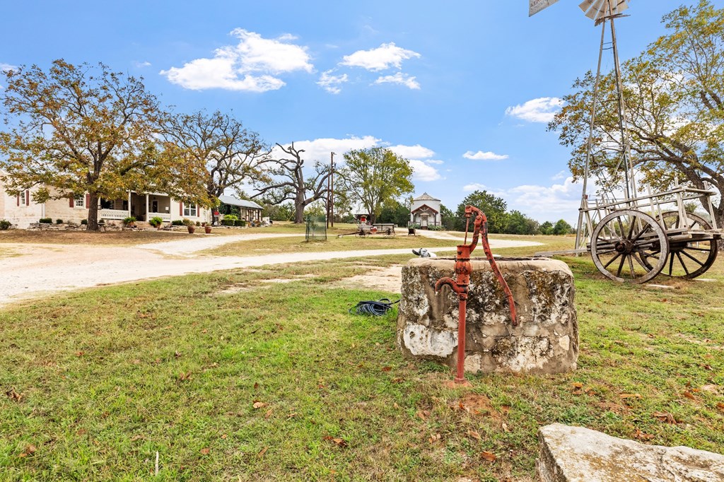 1447 Royal Oaks Loop Fredericksburg, TX 78624 - Photo 92 of 98 a view of a yard with swimming pool and trees