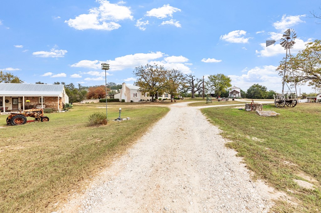 1447 Royal Oaks Loop Fredericksburg, TX 78624 - Photo 97 of 98 a view of a swimming pool with an outdoor space and seating area