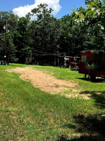 a view of backyard with green space