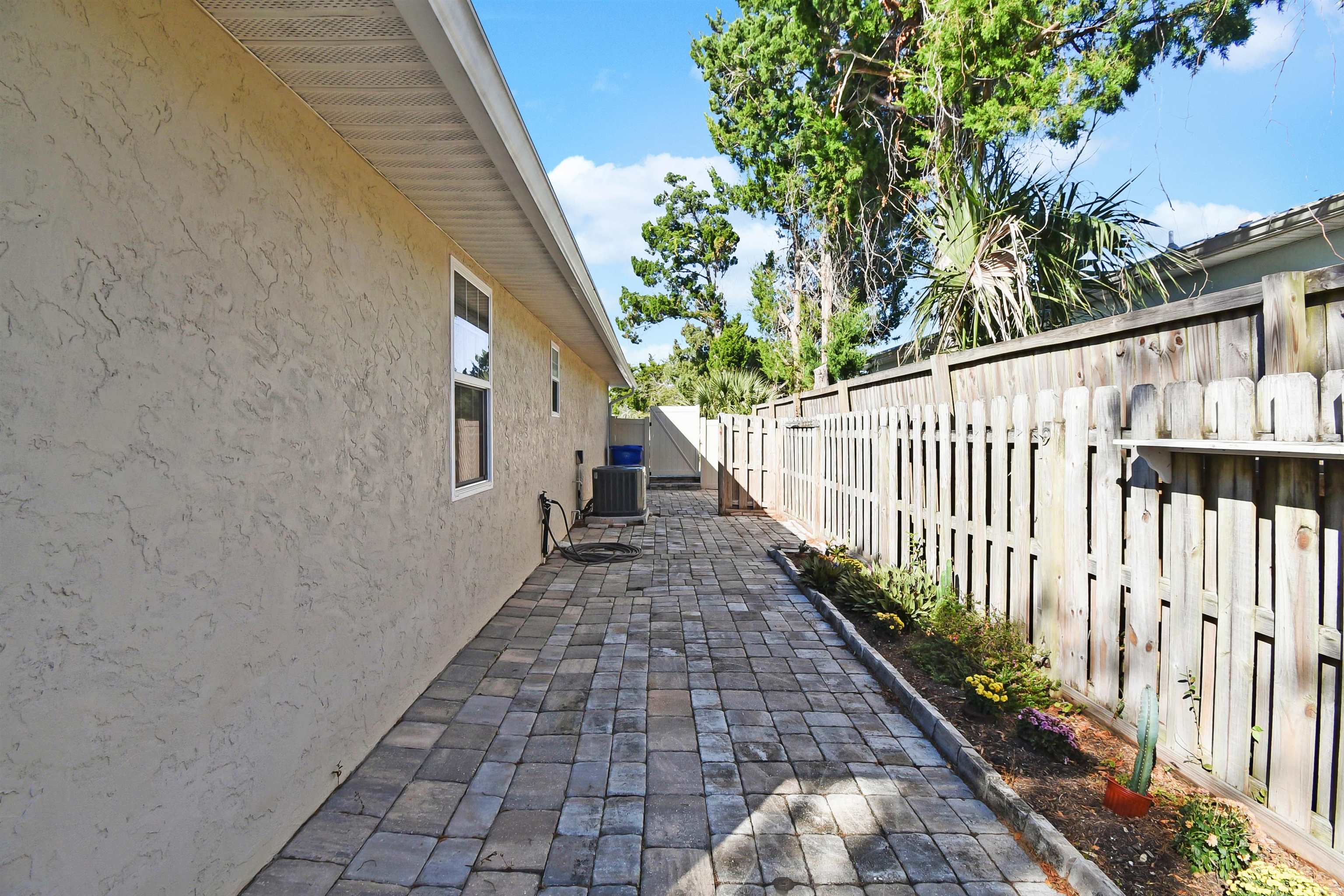 317 Mystical Way St. Augustine, FL 32080 - Photo 16 of 25 Fenced backyard featuring a patio area
