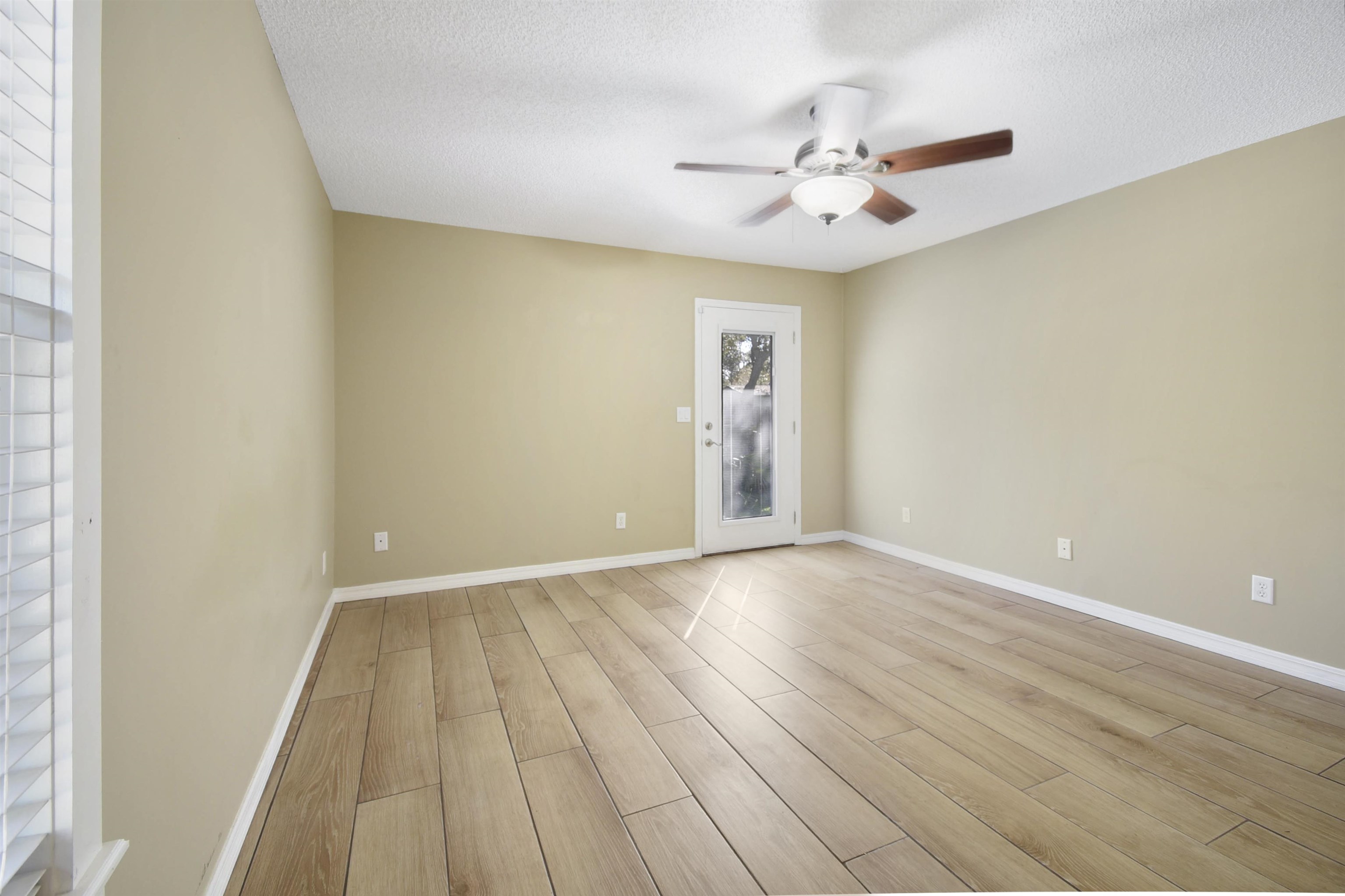 317 Mystical Way St. Augustine, FL 32080 - Photo 24 of 25 Spare room featuring a textured ceiling, light wood finished floors, and ceiling fan