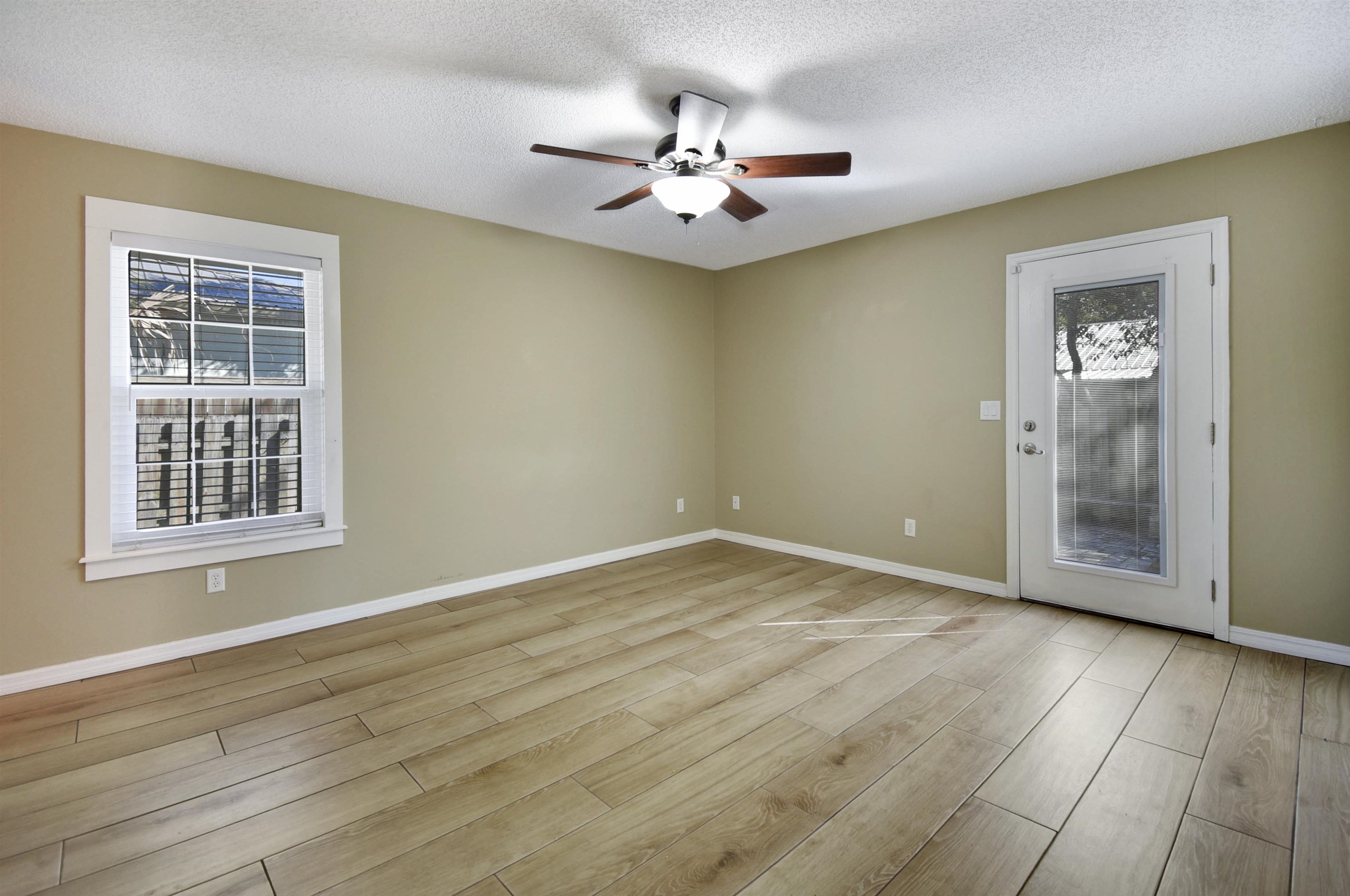 317 Mystical Way St. Augustine, FL 32080 - Photo 25 of 25 Unfurnished room featuring a textured ceiling, light wood finished floors, and a ceiling fan