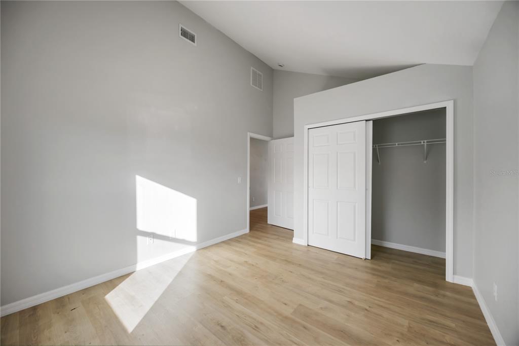 3294 West Price Boulevard North Port, FL 34286 - Photo 15 of 47 a view of an empty room with wooden floor and a window