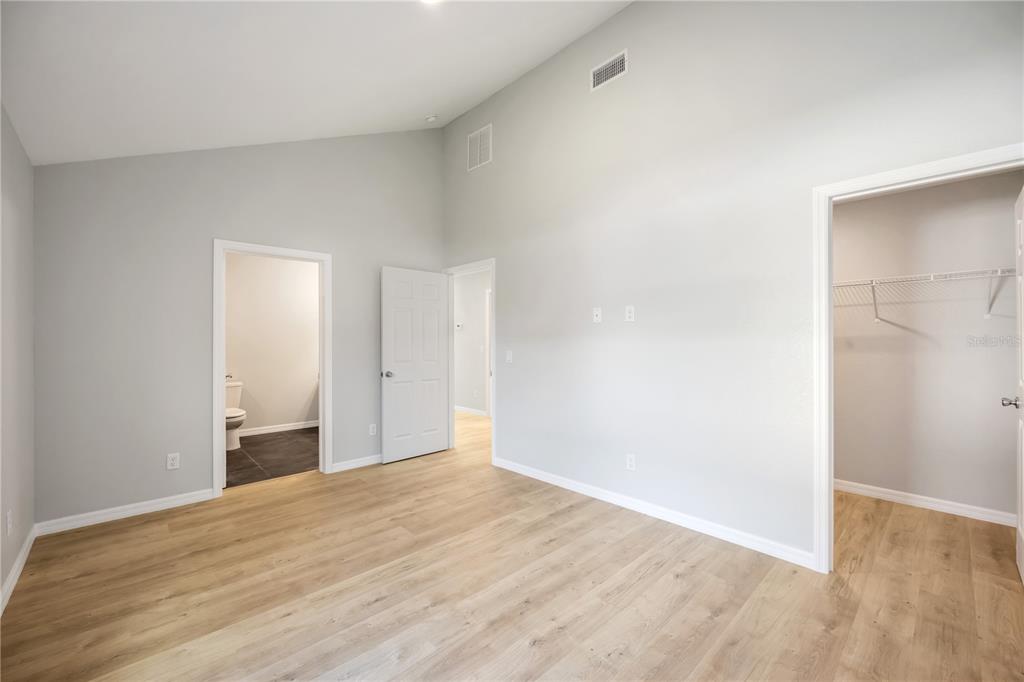 3294 West Price Boulevard North Port, FL 34286 - Photo 18 of 47 a view of an empty room with wooden floor