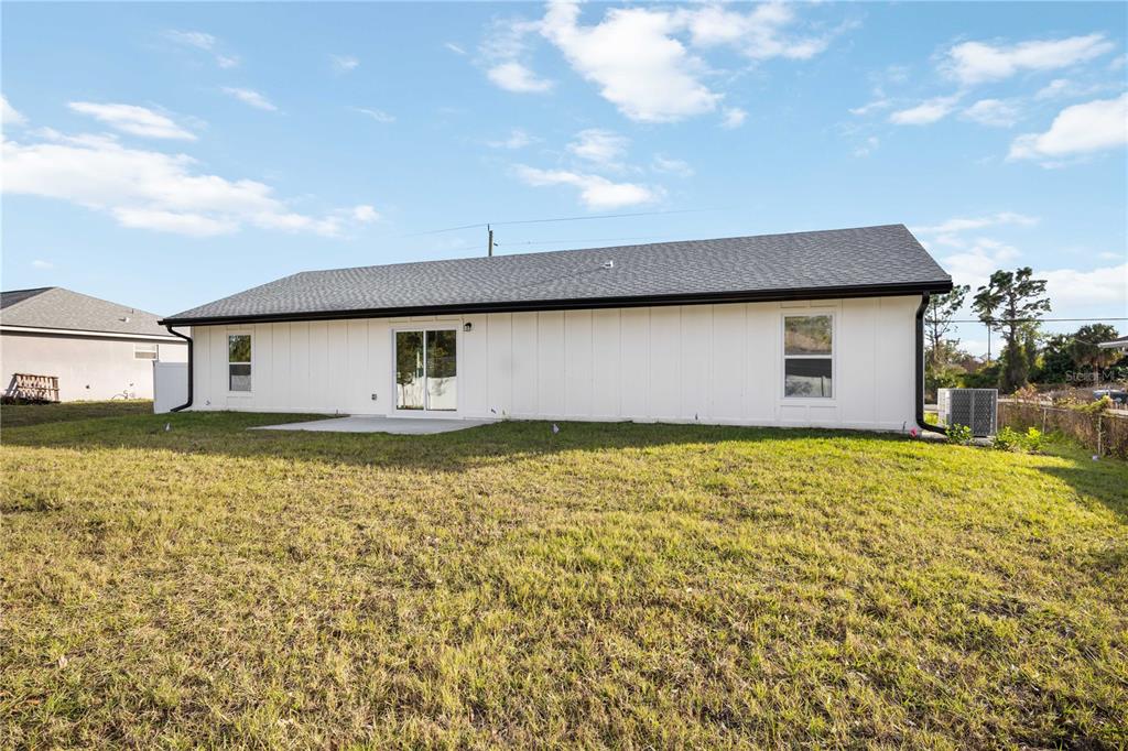 3294 West Price Boulevard North Port, FL 34286 - Photo 36 of 47 a front view of a house with a yard