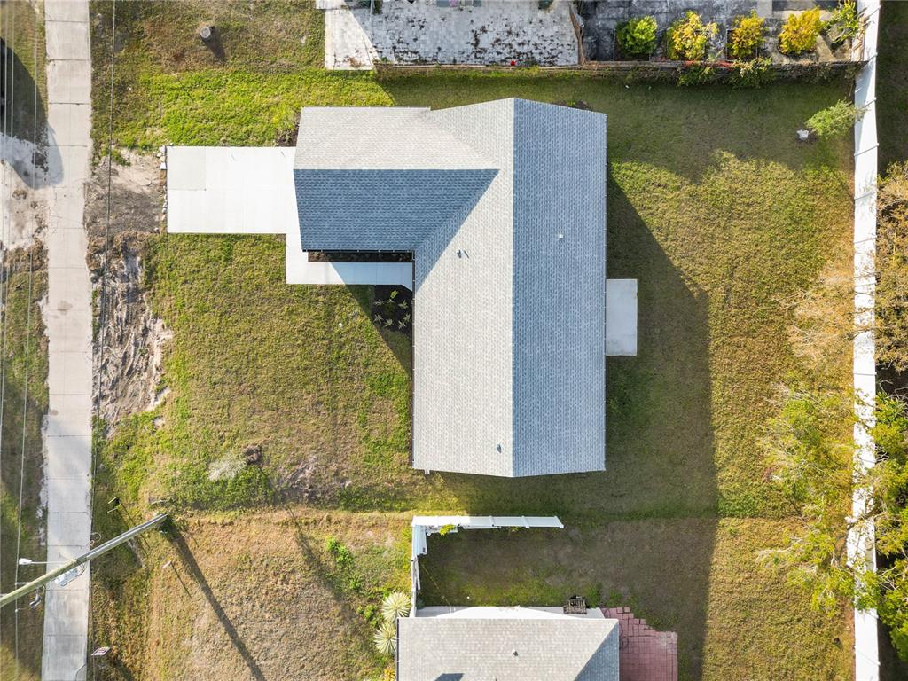 3294 West Price Boulevard North Port, FL 34286 - Photo 40 of 47 an aerial view of a house with a garden and lake view