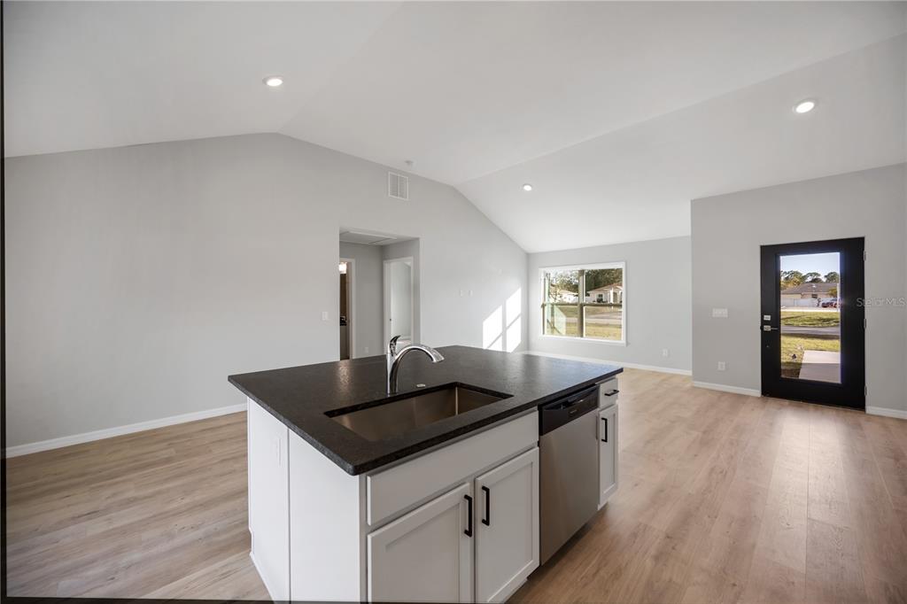 3294 West Price Boulevard North Port, FL 34286 - Photo 6 of 47 a kitchen with a sink and cabinets