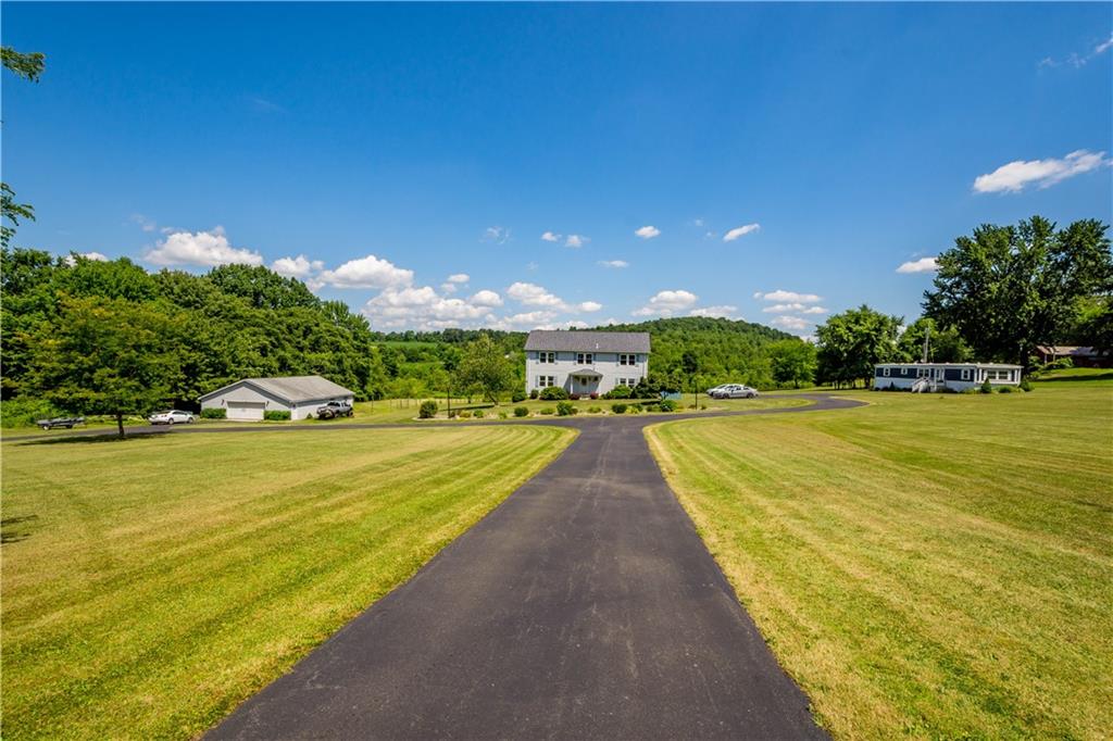 a view of a swimming pool with an outdoor space and seating area