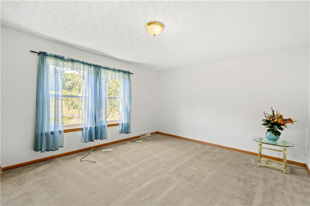 119 Cooper Road Slippery Rock, PA 16057 - Photo 12 of 25 a view of an empty room with a window