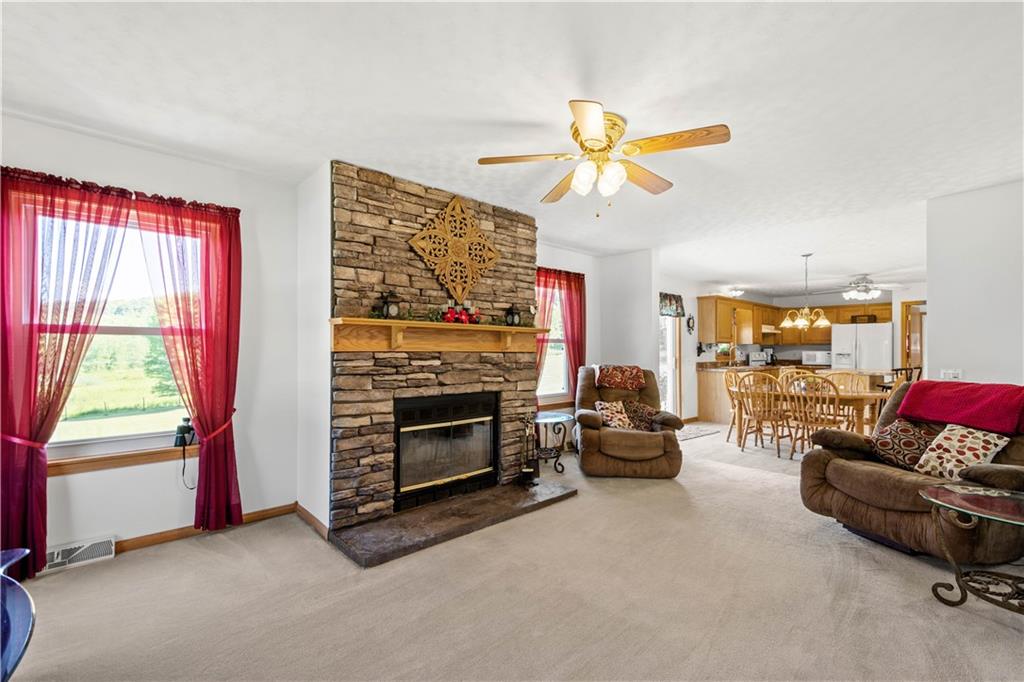 119 Cooper Road Slippery Rock, PA 16057 - Photo 14 of 25 a living room with furniture a ceiling fan and a window