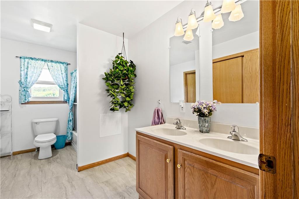 119 Cooper Road Slippery Rock, PA 16057 - Photo 19 of 25 a bathroom with a sink a mirror and a potted plant