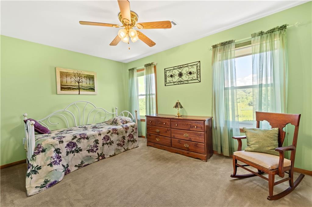 119 Cooper Road Slippery Rock, PA 16057 - Photo 20 of 25 a bed room with a bed and a chair