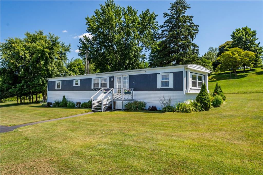 119 Cooper Road Slippery Rock, PA 16057 - Photo 24 of 25 a view of a house with a yard and a tree