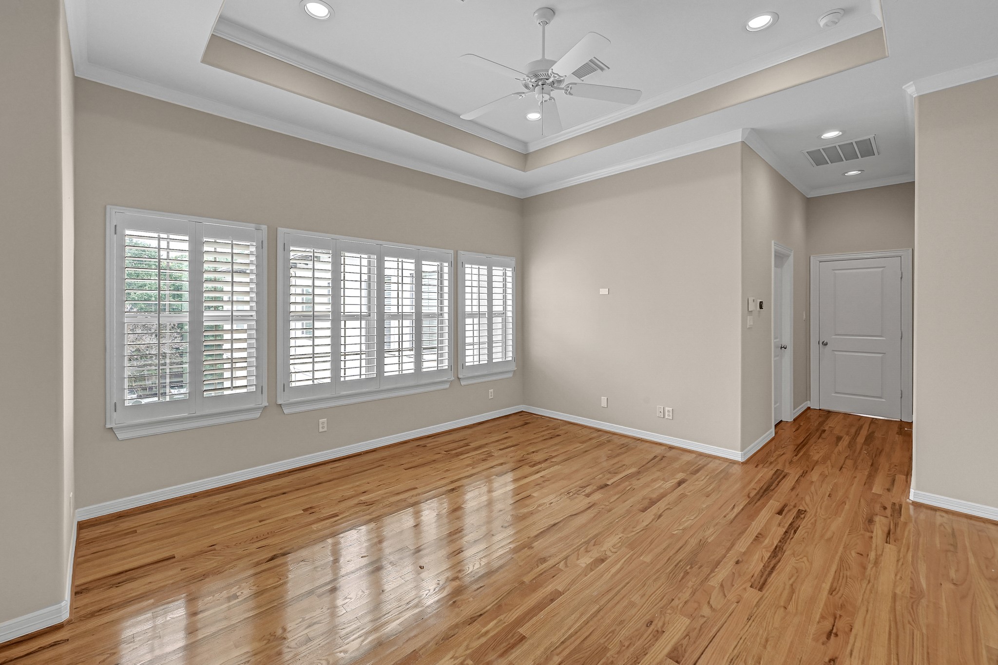 1204 Cohn Street Houston, TX 77007 - Photo 19 of 25 a view of an empty room with a window and wooden floor