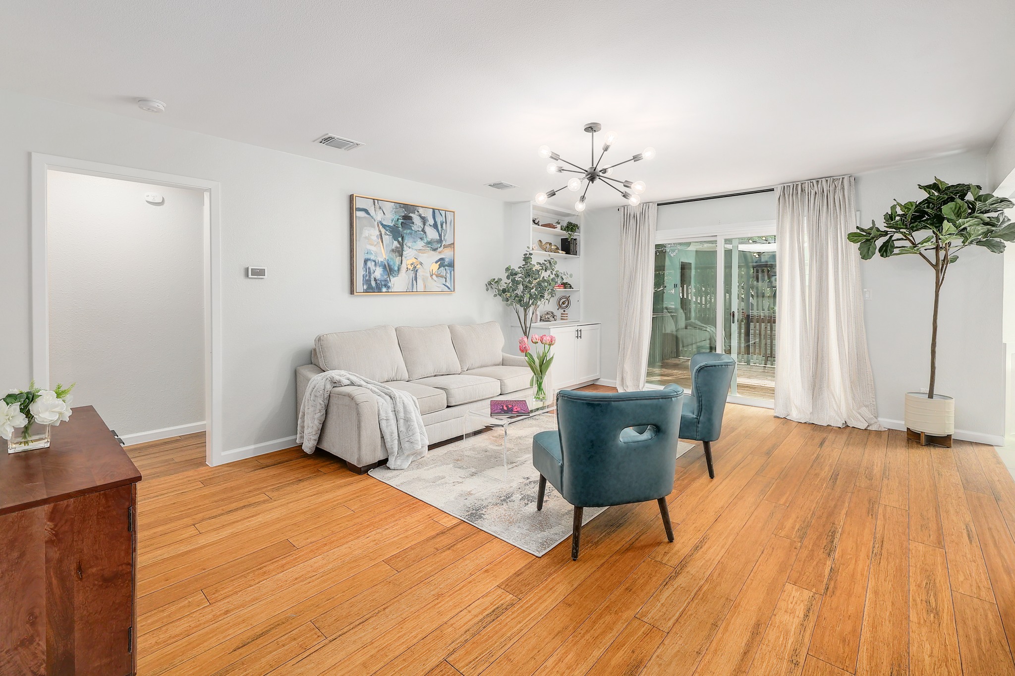 9614 Chukar Circle Austin, TX 78758 - Photo 7 of 26 Soft, neutral white paint pairs well with any design while chic designer fixtures elevate the aesthetic.