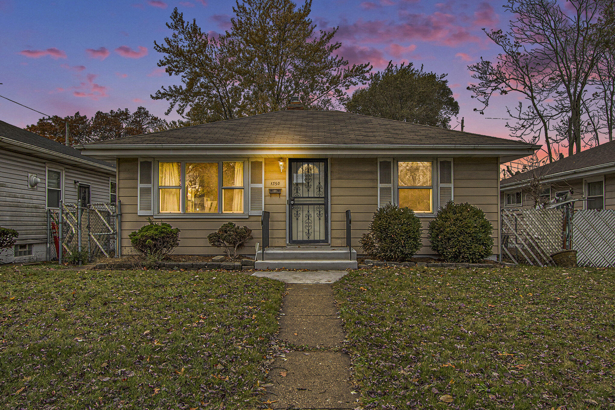 1350 Morton Street Gary, IN 46404 - Photo 2 of 17 a front view of a house with garden
