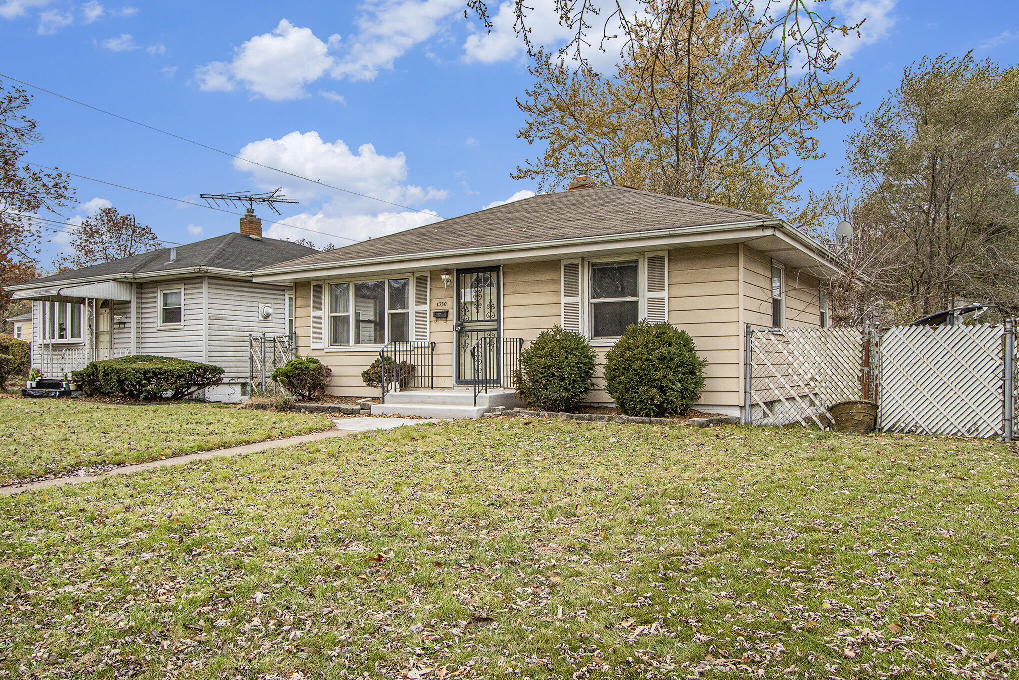1350 Morton Street Gary, IN 46404 - Photo 4 of 17 a front view of a house with garden