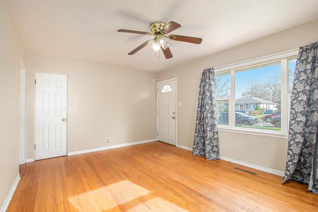 a view of an empty room with a window
