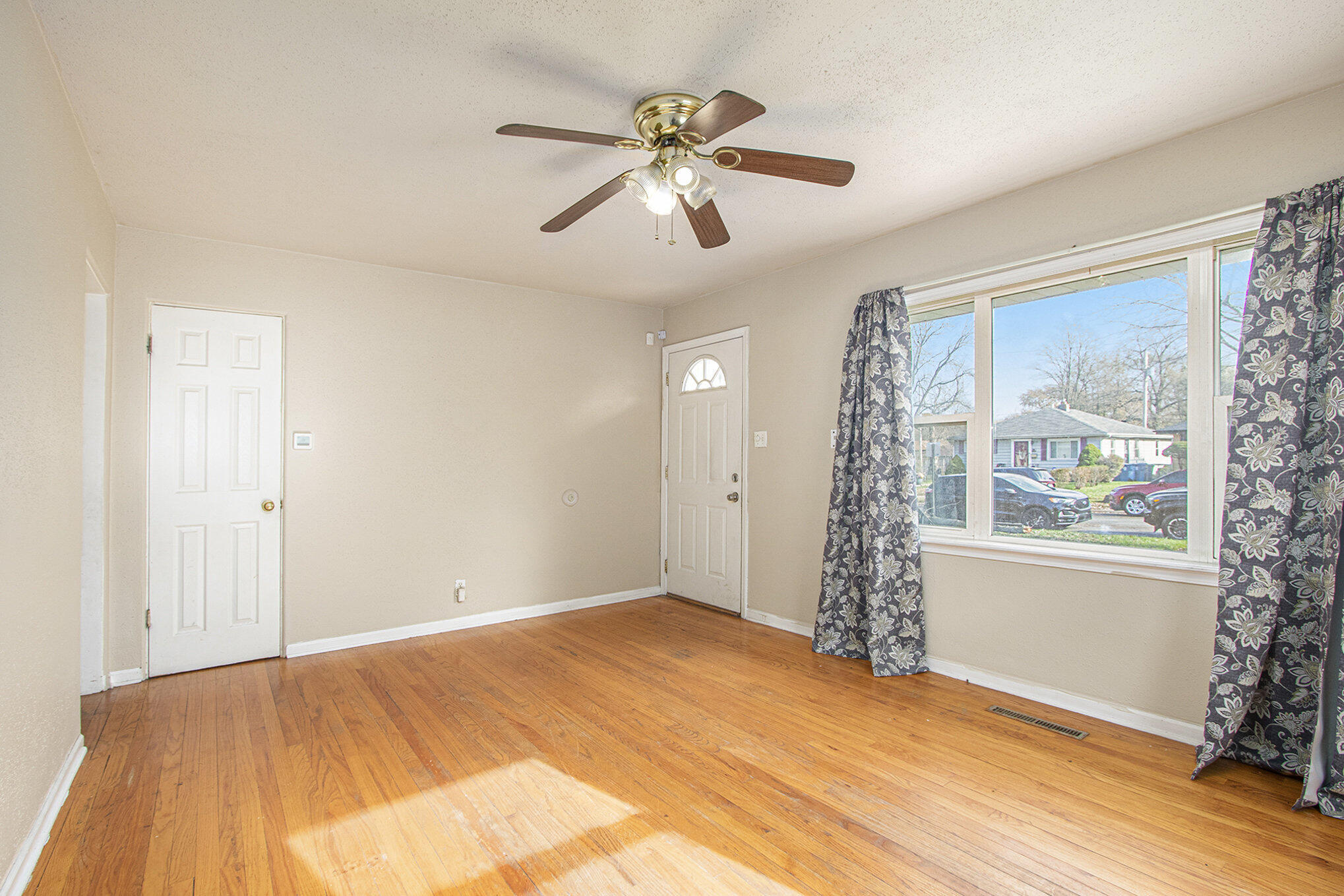 1350 Morton Street Gary, IN 46404 - Photo 6 of 17 a view of an empty room with a window