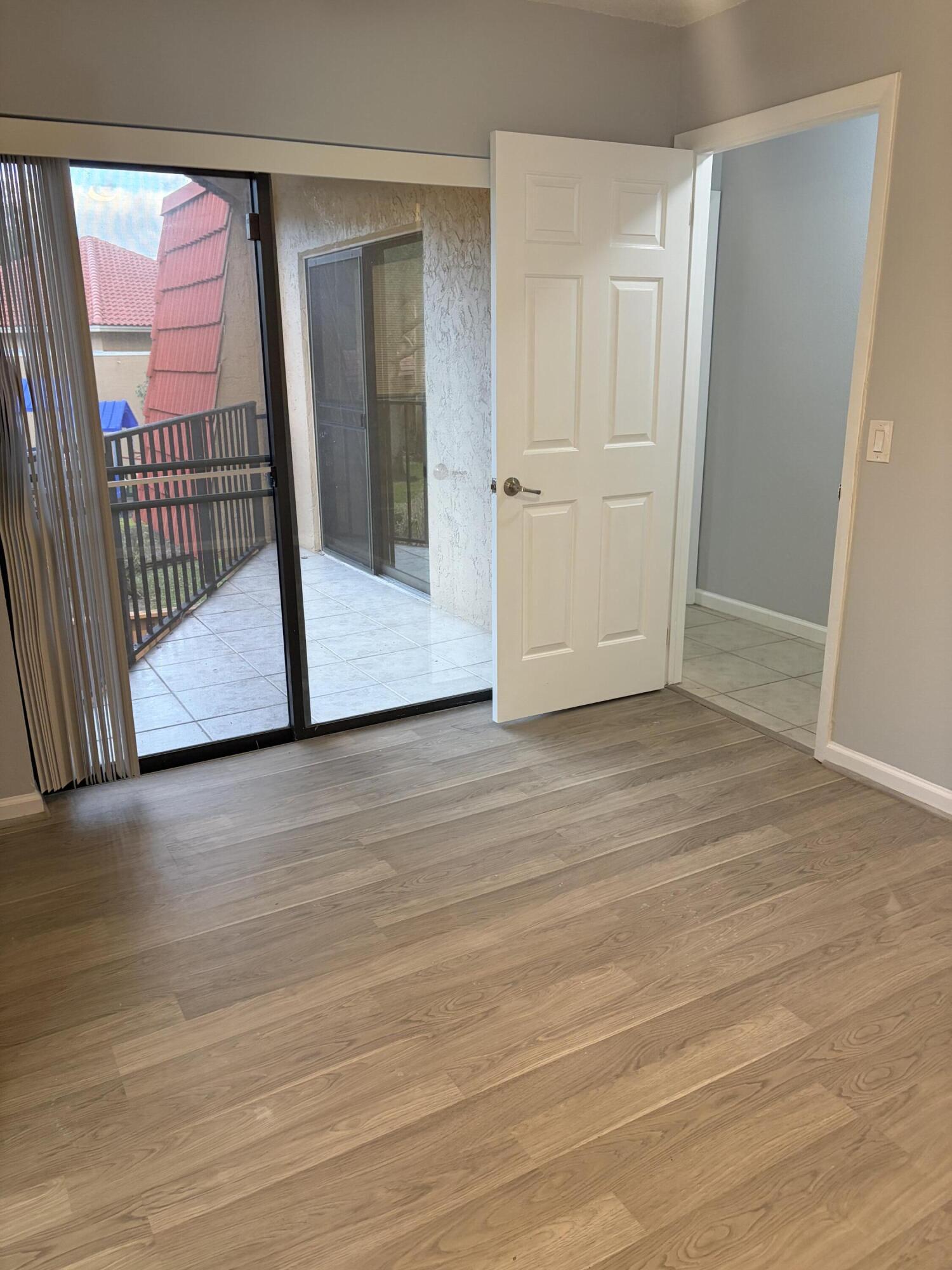 8165 Severn Drive, Unit D Boca Raton, FL 33433 - Photo 8 of 14 a view of a room with wooden floor