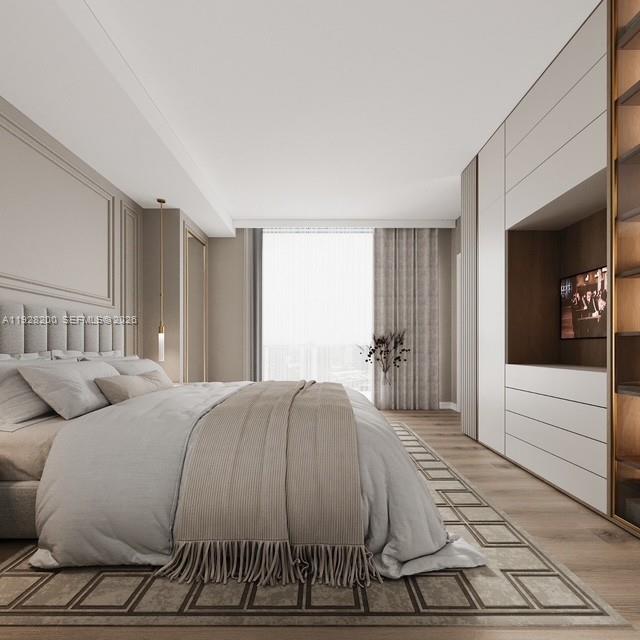 45 Southwest 9th Street, Unit 2303 Miami, FL 33130 - Photo 12 of 33 a bedroom with a bed and a large window