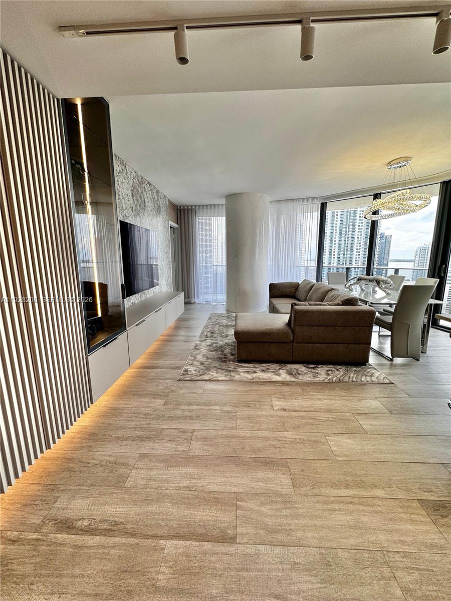 45 Southwest 9th Street, Unit 2303 Miami, FL 33130 - Photo 4 of 33 a view of kitchen with furniture and flat screen tv