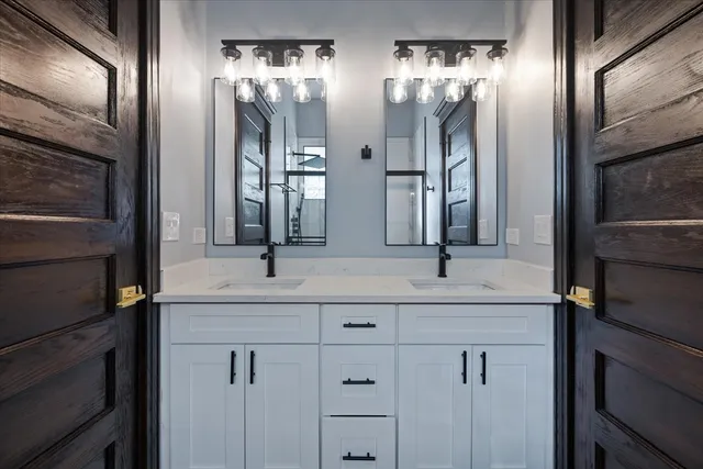 a kitchen with a refrigerator sink and cabinets