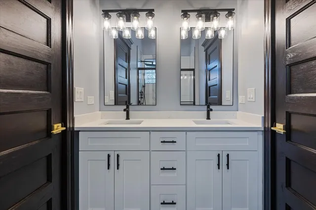 a bathroom with a shower toilet and sink