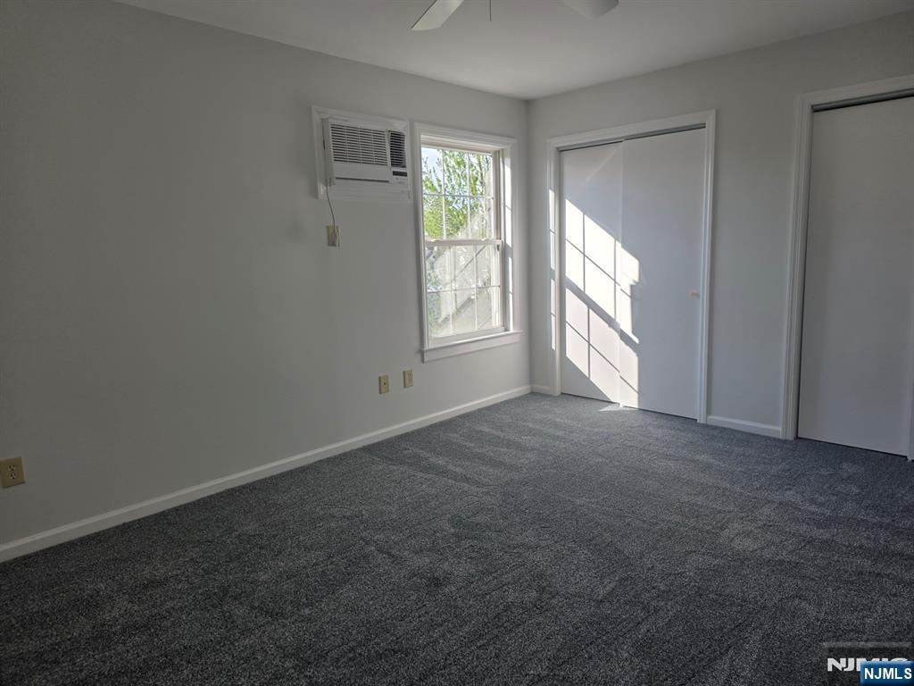 633 10th Street, Unit 2 Lyndhurst, NJ 07071 - Photo 6 of 11 an empty room with windows