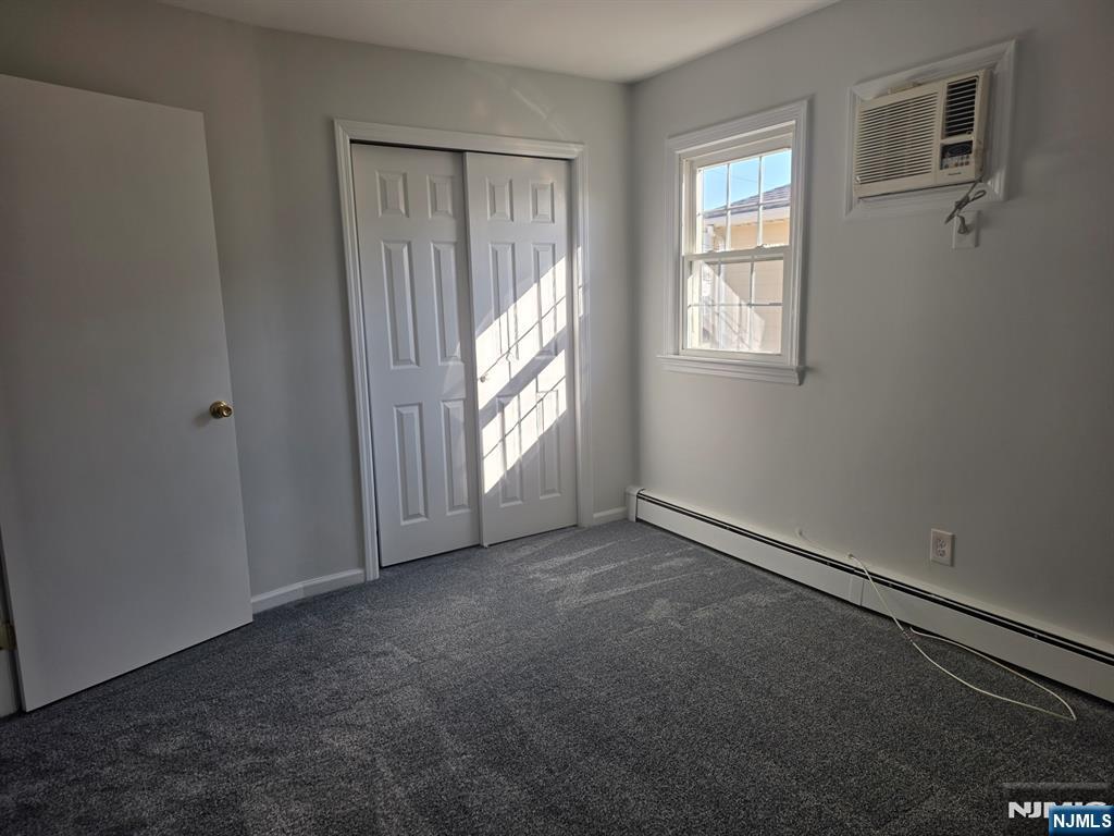 633 10th Street, Unit 2 Lyndhurst, NJ 07071 - Photo 9 of 11 an empty room with windows
