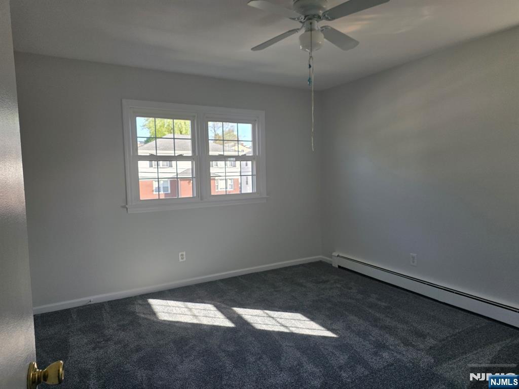 633 10th Street, Unit 2 Lyndhurst, NJ 07071 - Photo 10 of 11 an empty room with a window