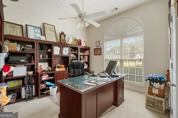 a view of kitchen with stainless steel appliances granite countertop stove top oven and cabinets