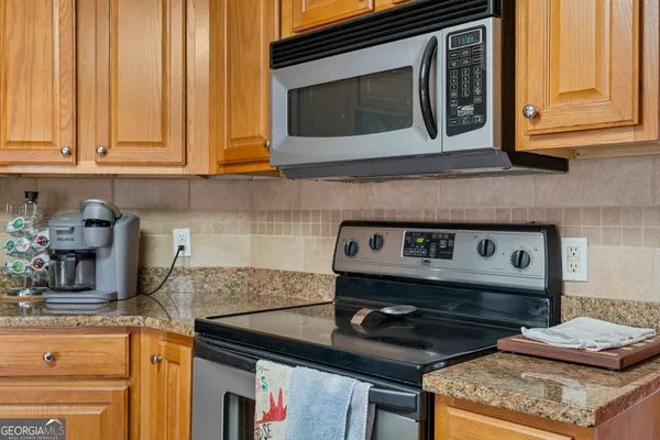 a kitchen with a stove and a microwave