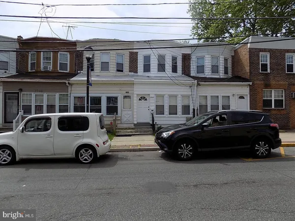 a car parked in front of a house