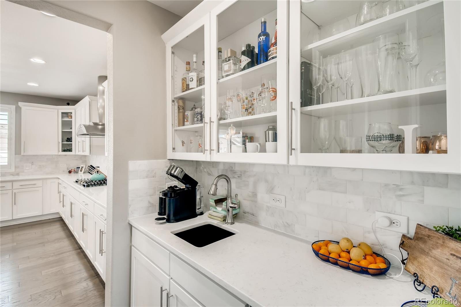 14402 Double Dutch Circle Parker, CO 80134 - Photo 11 of 31 a kitchen with a sink and a stove next to a window