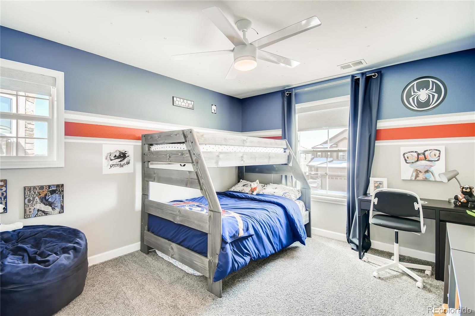14402 Double Dutch Circle Parker, CO 80134 - Photo 18 of 31 a bedroom with a bed and a desk