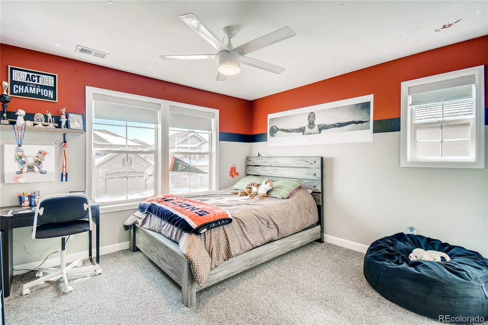14402 Double Dutch Circle Parker, CO 80134 - Photo 19 of 31 a bedroom with a bed and a large window