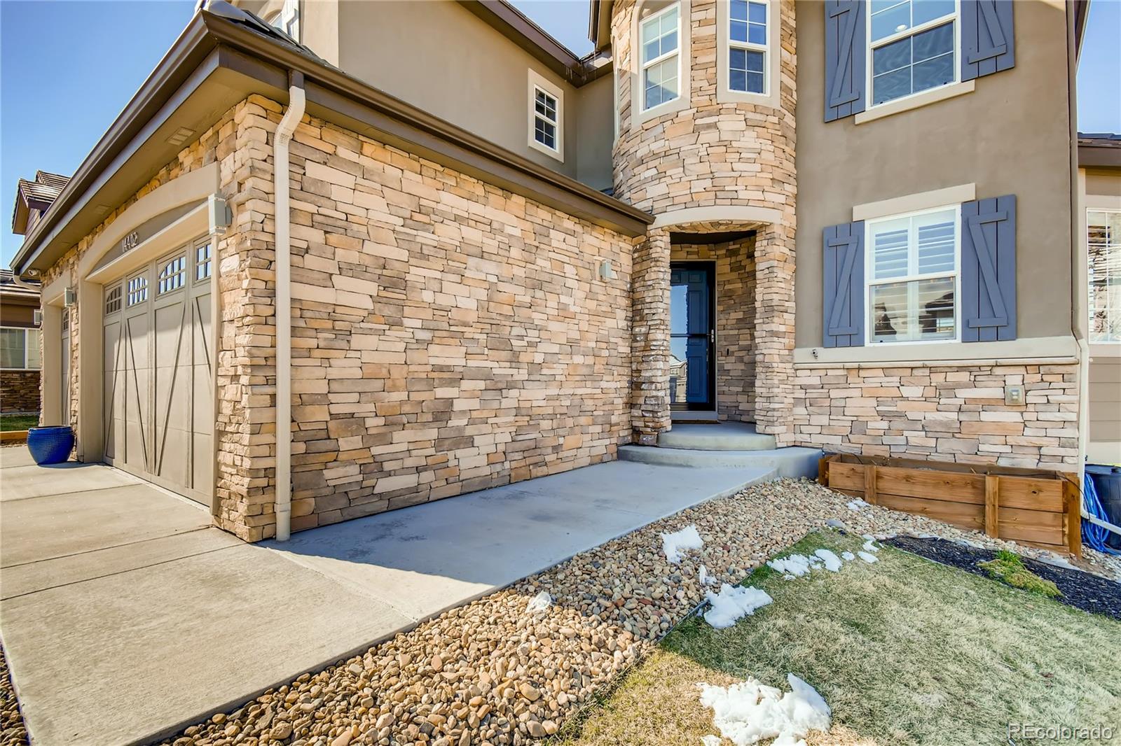 14402 Double Dutch Circle Parker, CO 80134 - Photo 2 of 31 a view of a brick house with many windows