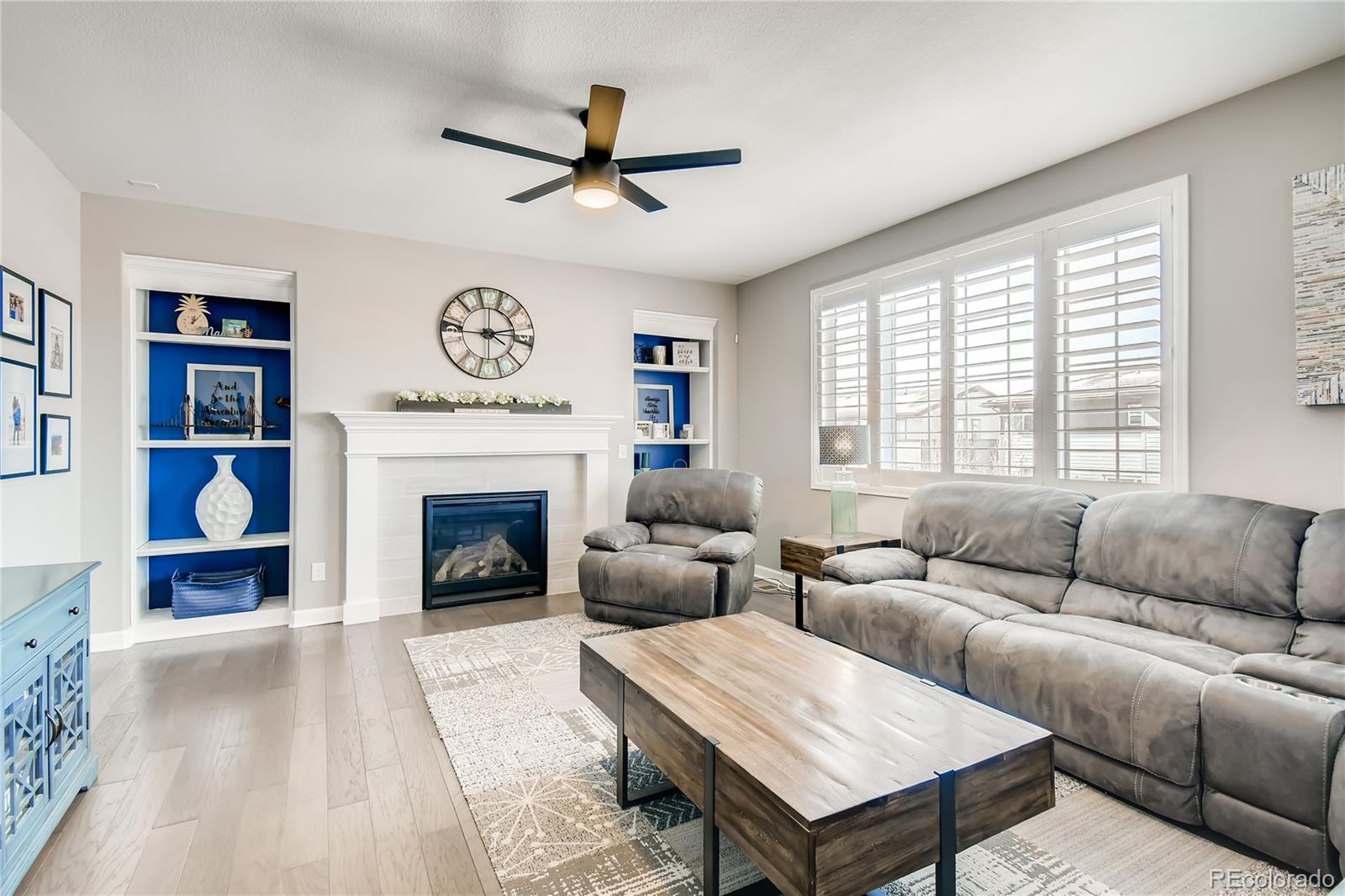 14402 Double Dutch Circle Parker, CO 80134 - Photo 3 of 31 a living room with furniture and a fireplace