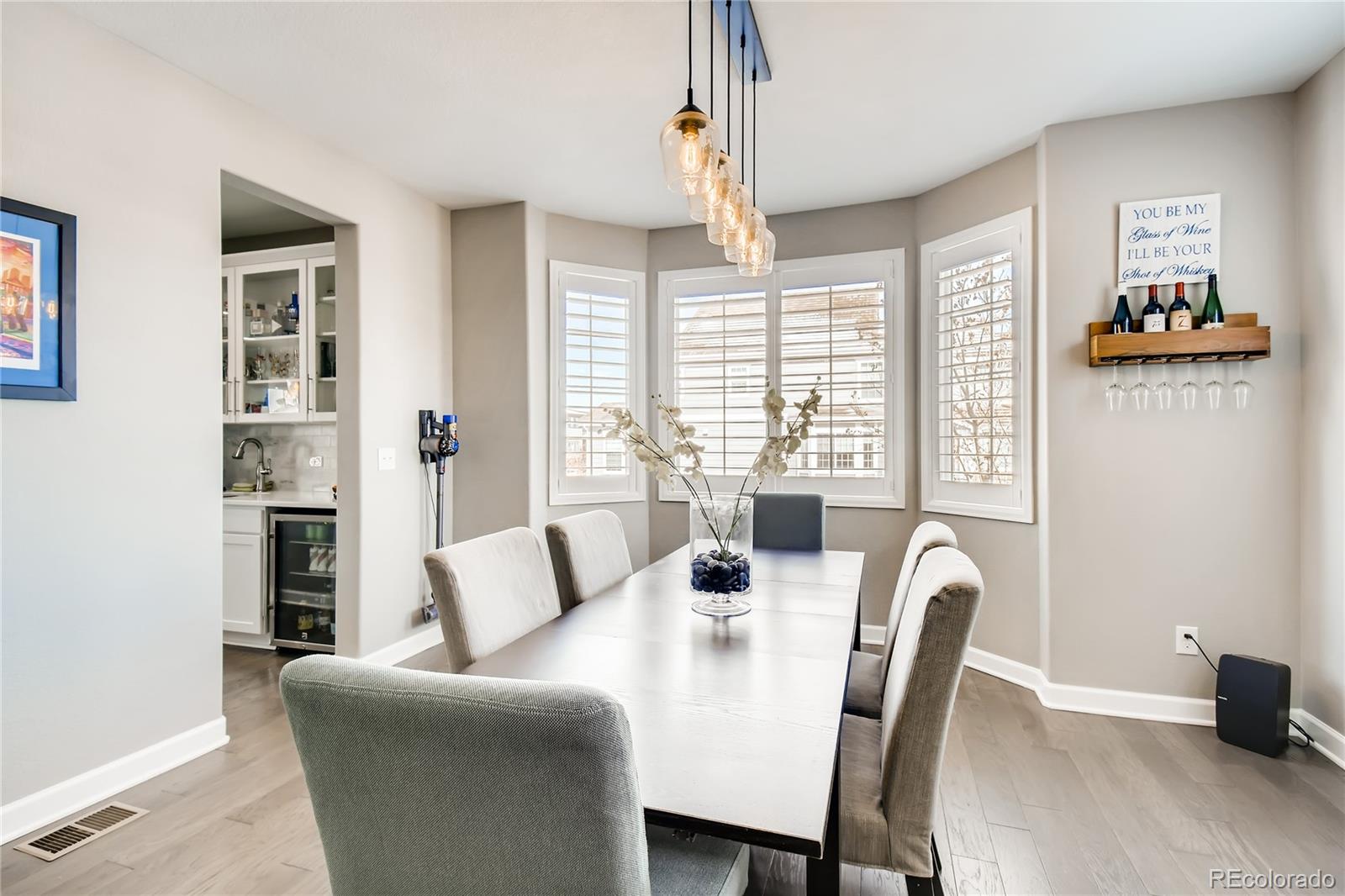 14402 Double Dutch Circle Parker, CO 80134 - Photo 5 of 31 a view of a dining room with furniture and wooden floor