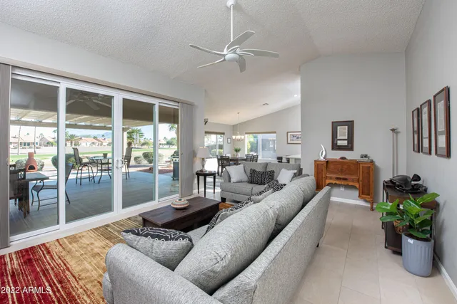 a living room with furniture and a table