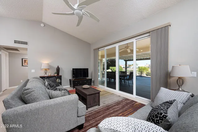 a living room with furniture and a window