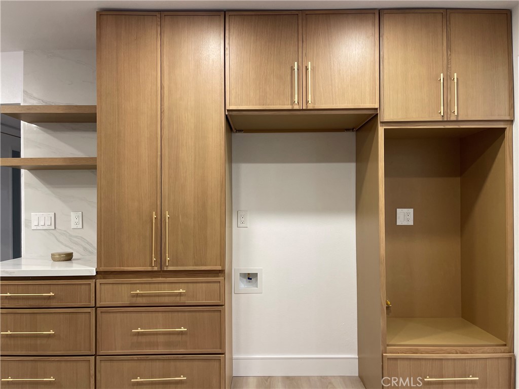 1410 Pleasant View Drive Redlands, CA 92374 - Photo 11 of 44 a kitchen with granite countertop cabinets and black door