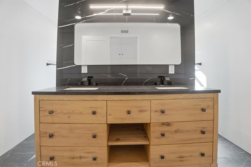 1410 Pleasant View Drive Redlands, CA 92374 - Photo 25 of 44 a bathroom with a sink and a mirror