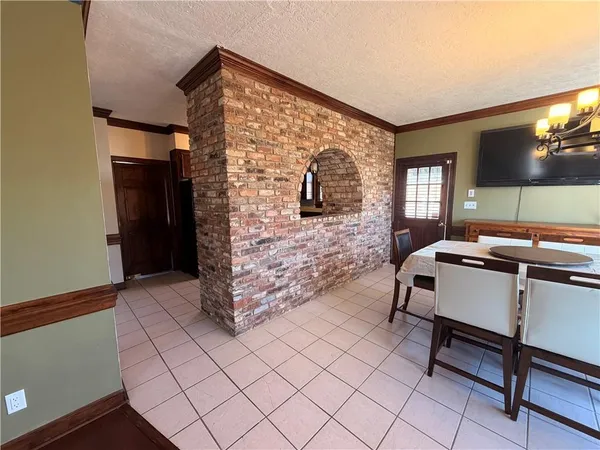 a spacious bedroom with a bed and a desk in it