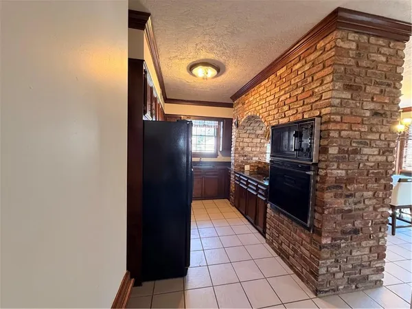 a hallway with a stove top oven