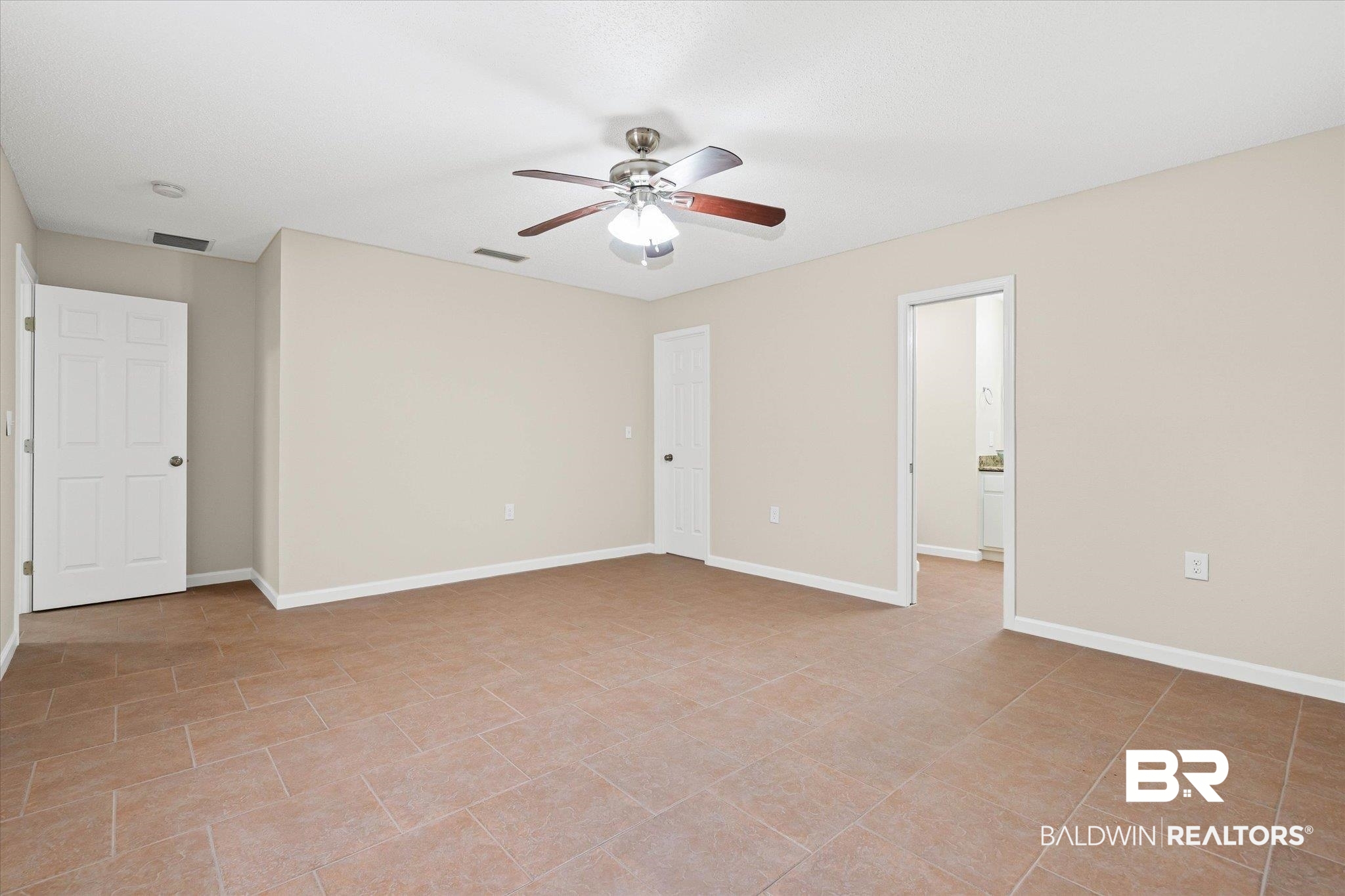 157 Bay View Drive Daphne, AL 36526 - Photo 8 of 22 Unfurnished bedroom featuring ceiling fan and light tile patterned floors